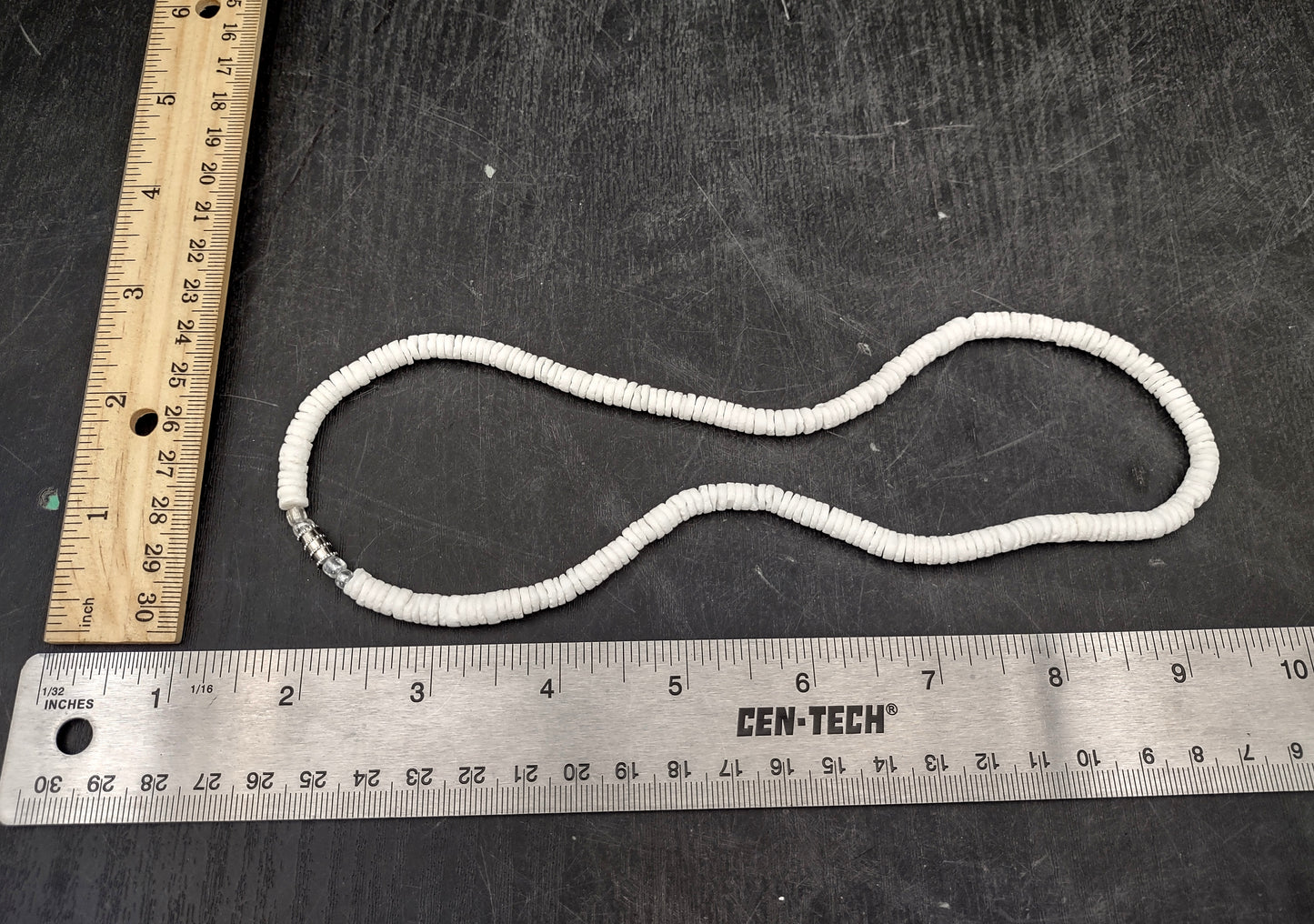 White Puka-Style Shell Necklace - (1 necklace 18 inches x 4-5mm) on blue background. Copyright 2022 SeaShellSupply.com.