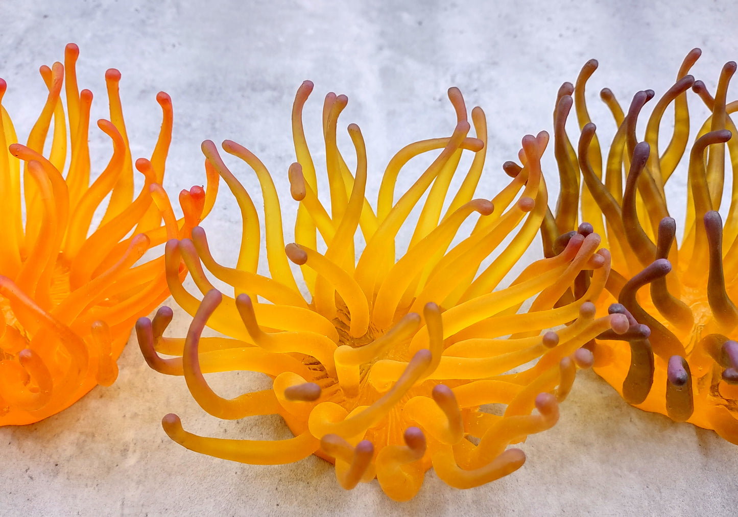Condylactis Yellow FAUX Anemone - Condylactis Gigantea - (1 Anemone approx. 10x9x8 inches. A orange and yellow hinted stringy shiny fake anemone. Copyright 2024 SeaShellSupply.com.