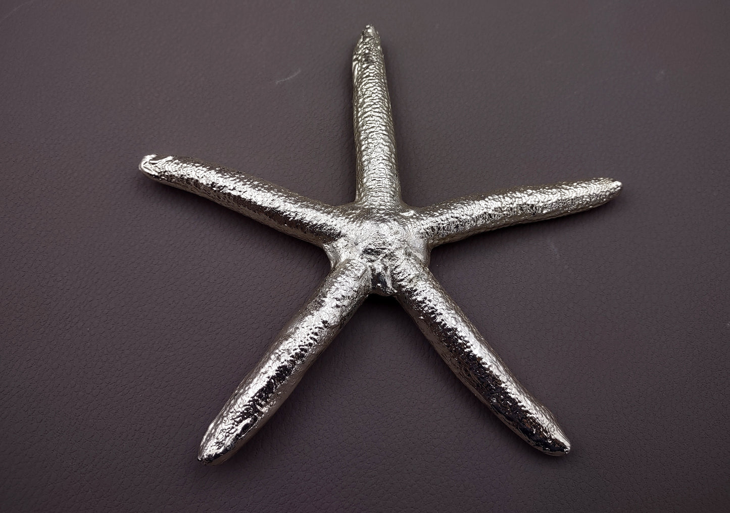 Silver Plated Real Linckia Starfish - (1 Seastar approx. 5+ inches) One silver plated star fish. Copyright 2024 SeaShellSupply.com