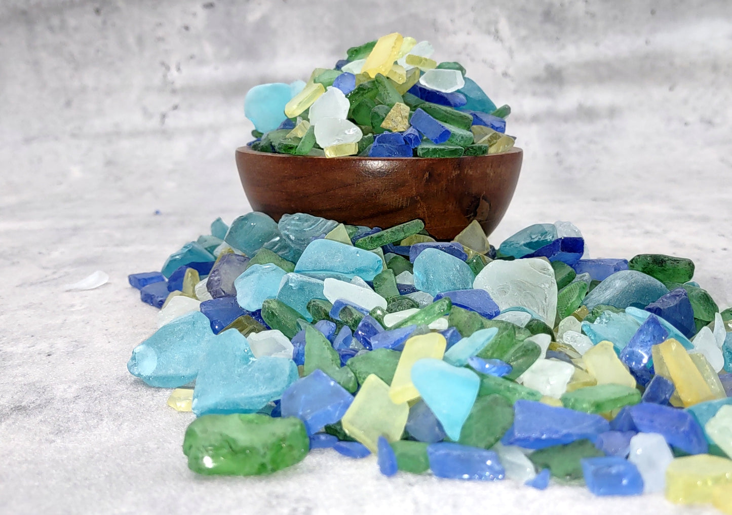 Beach Glass - Medium Tumbled Rough Blue, Green & White Atlantic Assorted - (approx. 1 Kilogram/2.2 lbs. .5-1.25 inches). Multiple different shapes and sizes pieces all in a pile. Copyright 2024 SeaShellMart.com.