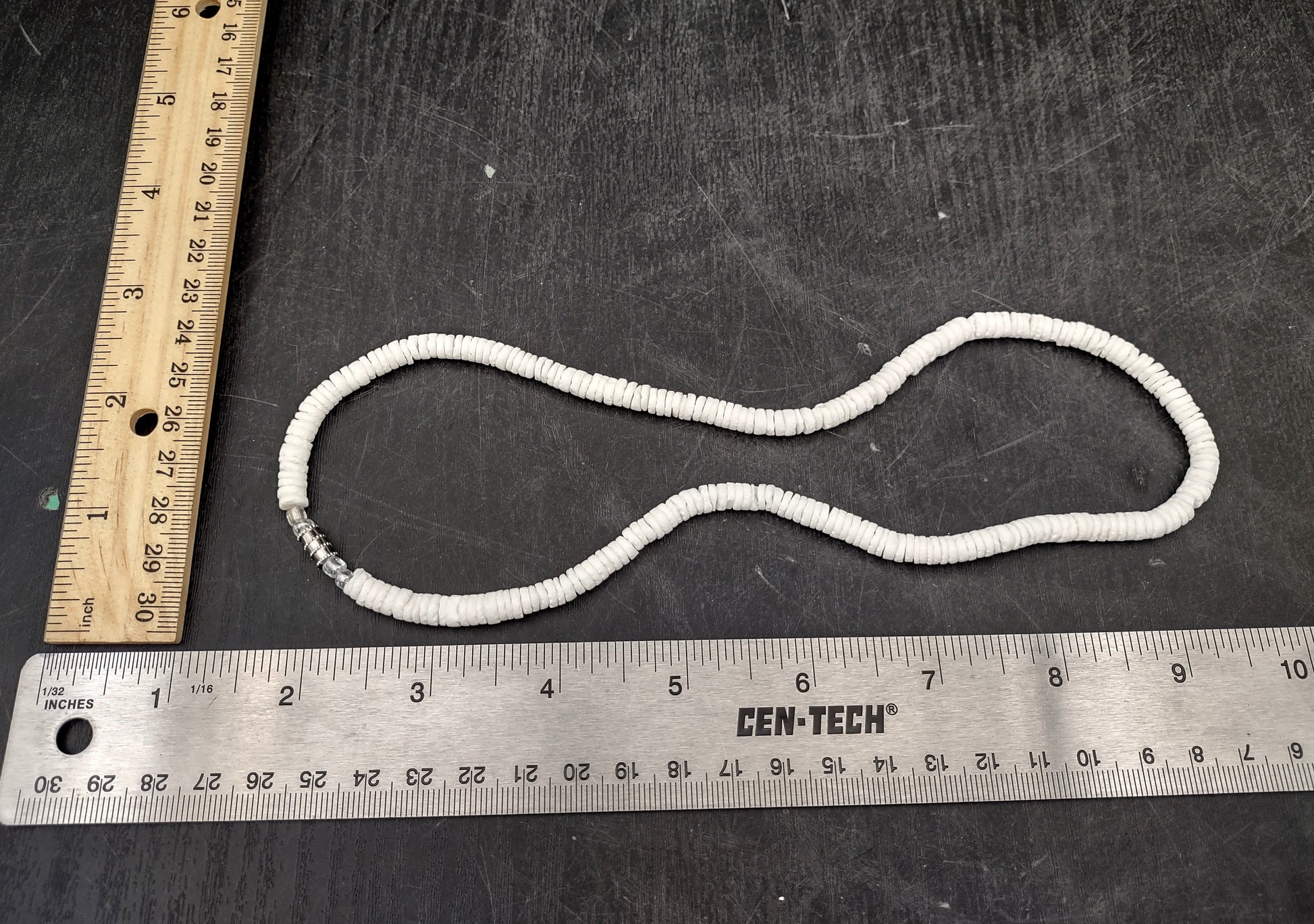 White Puka-Style Shell Necklace - (1 necklace 18 inches x 4-5mm) on blue background.  Copyright 2022 SeaShellSupply.com.