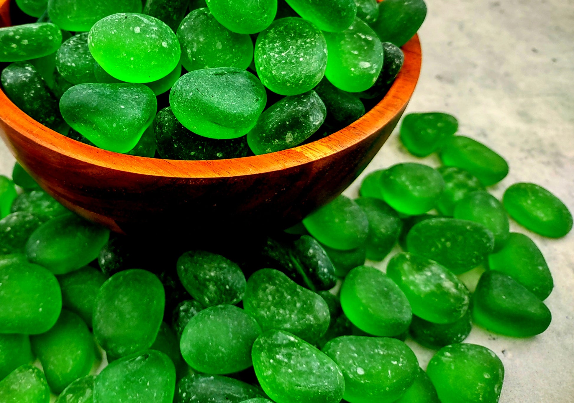 Beach Sea Glass Rounded Green Frosted Tumbled Pebbles (approx. 10 lbs. 1-1.5 inch). Green Beach Glass pebbles. Copyright 2022 SeaShellSupply.com.