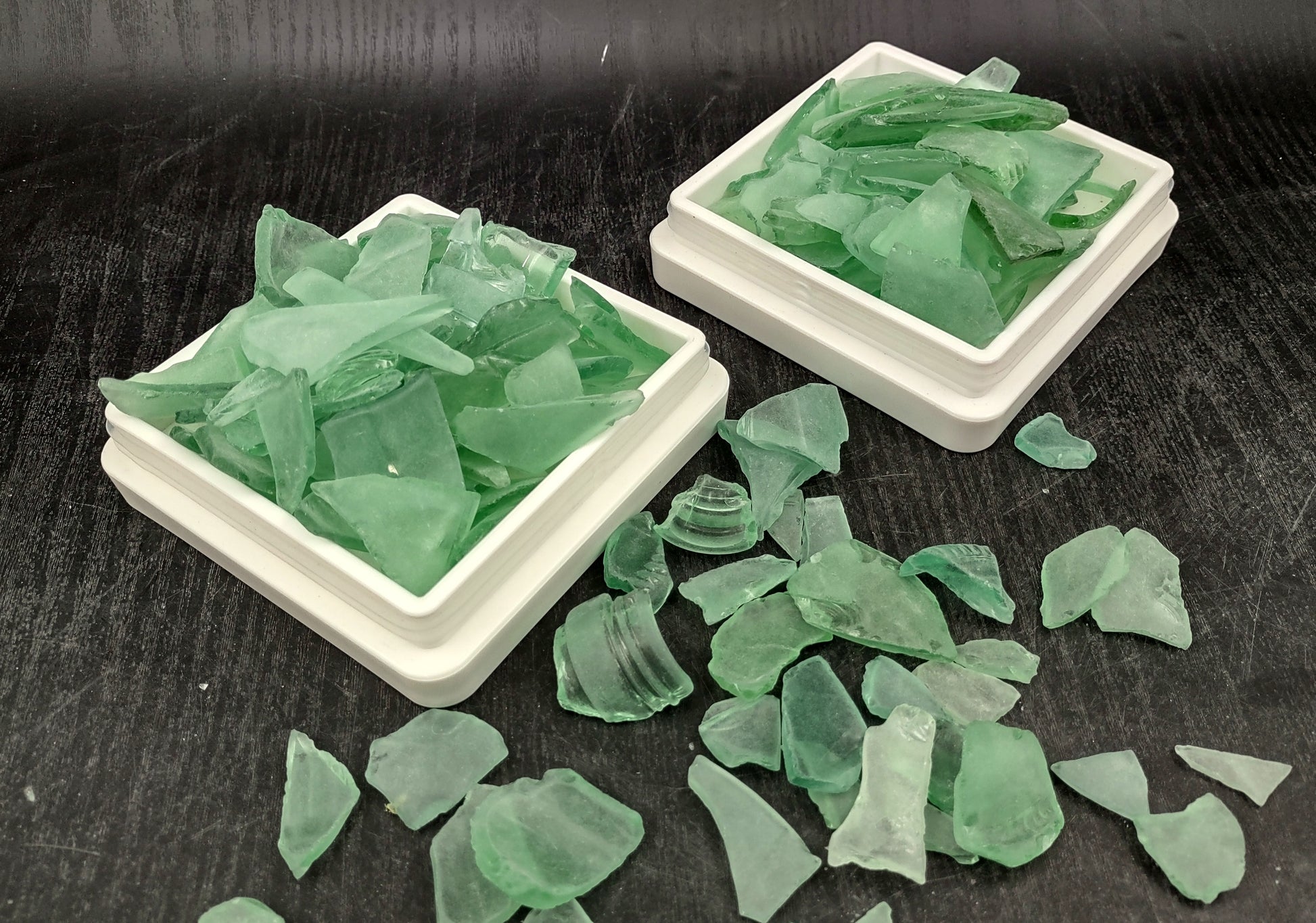 Beach Glass - Medium Tumbled Rough Coke Bottle Green - (approx. 1 Kilogram/2.2 lbs. .5-1.25 inches). Multiple green glass pieces in different shapes. Copyright 2024 SeaShellSupply.com.