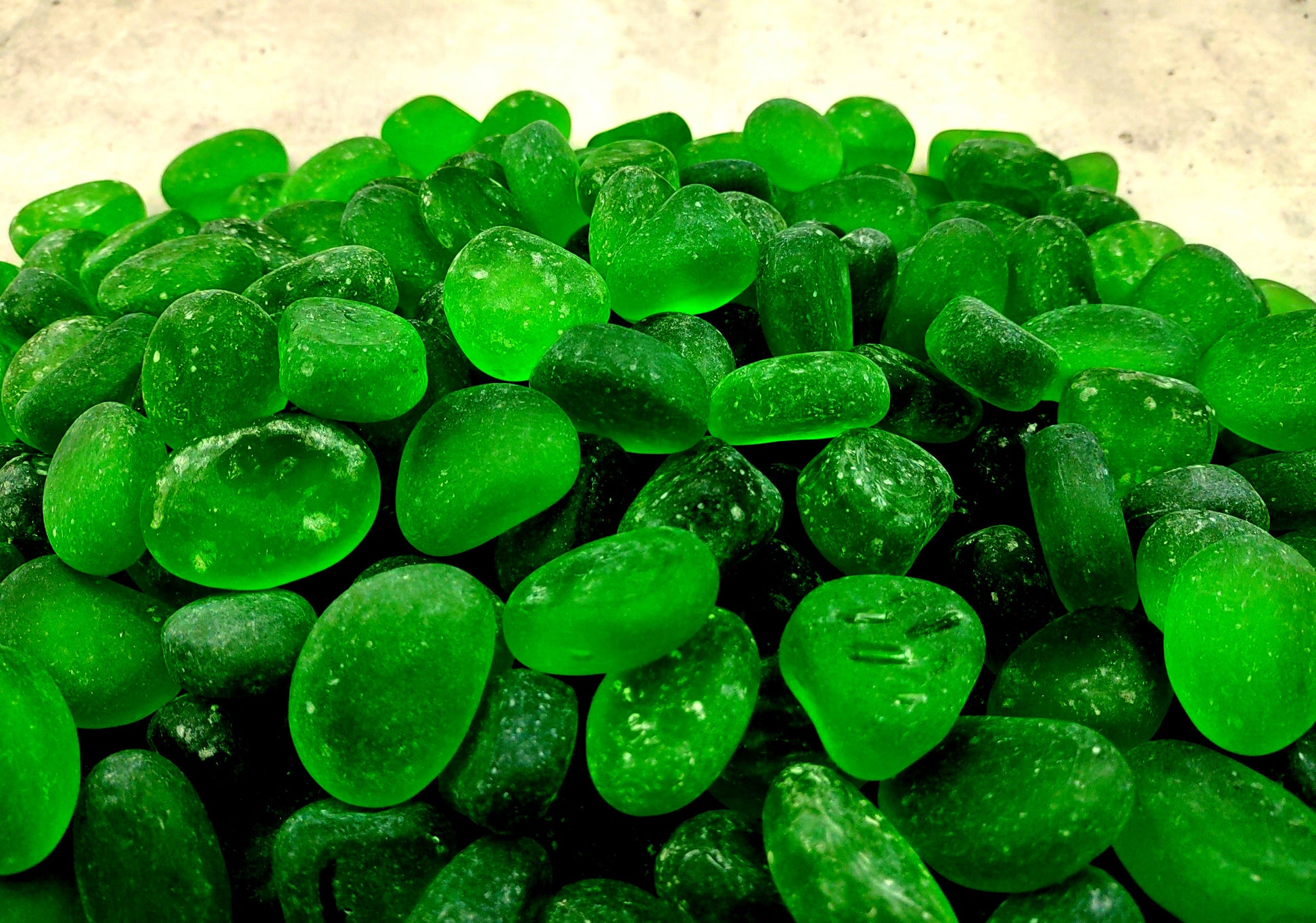 Beach Sea Glass Rounded Green Frosted Tumbled Pebbles (approx. 10 lbs. 1-1.5 inch). Green Beach Glass pebbles. Copyright 2022 SeaShellSupply.com.