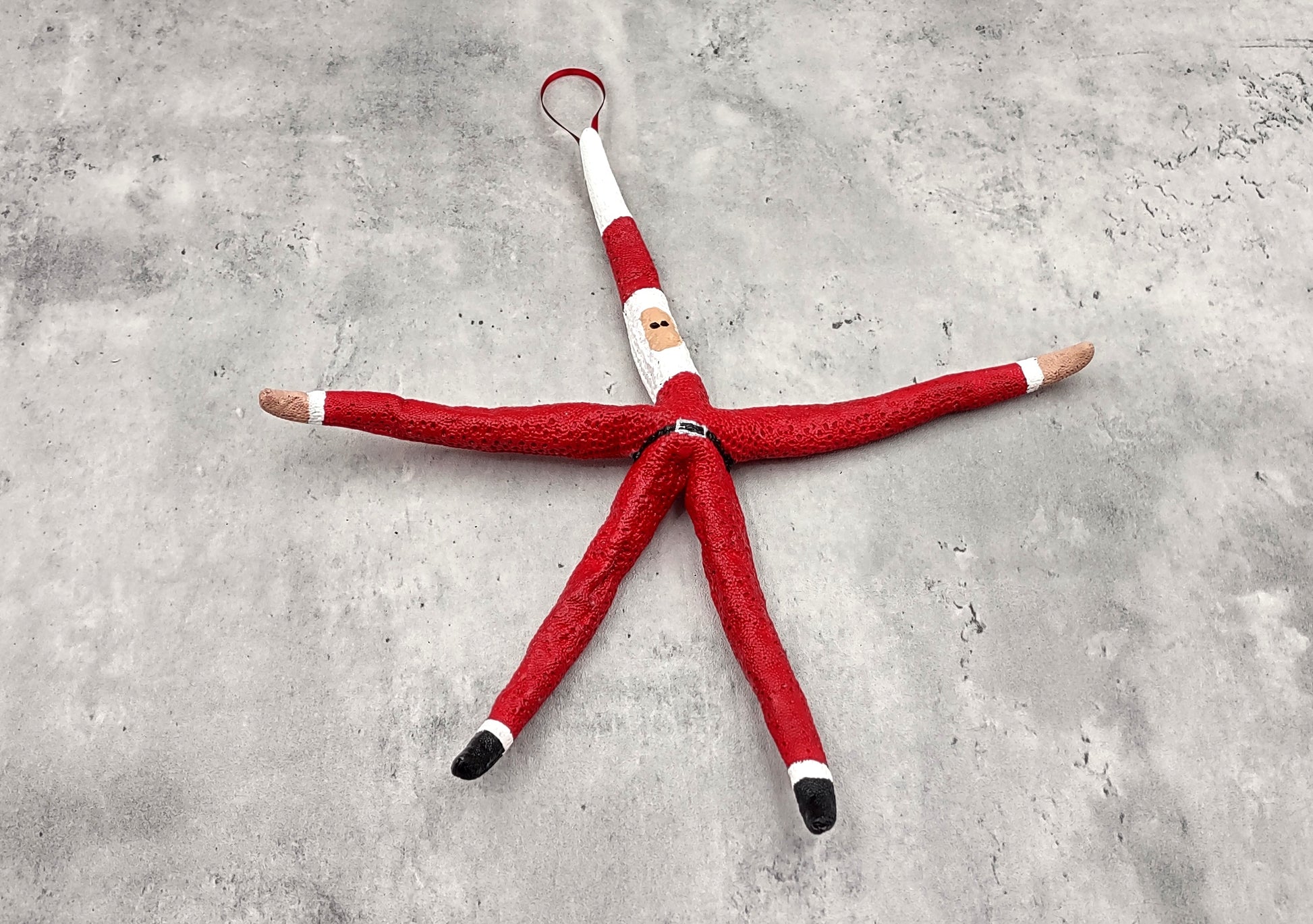 Red Linckia Starfish Santa Claus Ornament (1 seastar approx. 10-12 inches) Painted Santa Claus Starfish Ornament For Coastal Beach Christmas. Copyright 2023 SeaShellSupply.com.