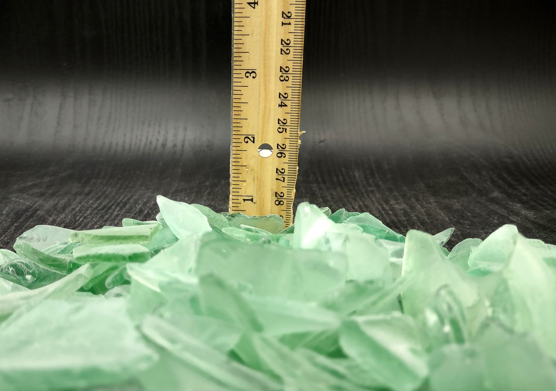 Beach Glass - Medium Tumbled Rough Coke Bottle Green - (approx. 1 Kilogram/2.2 lbs. .5-1.25 inches). Multiple green glass pieces in different shapes. Copyright 2024 SeaShellSupply.com.