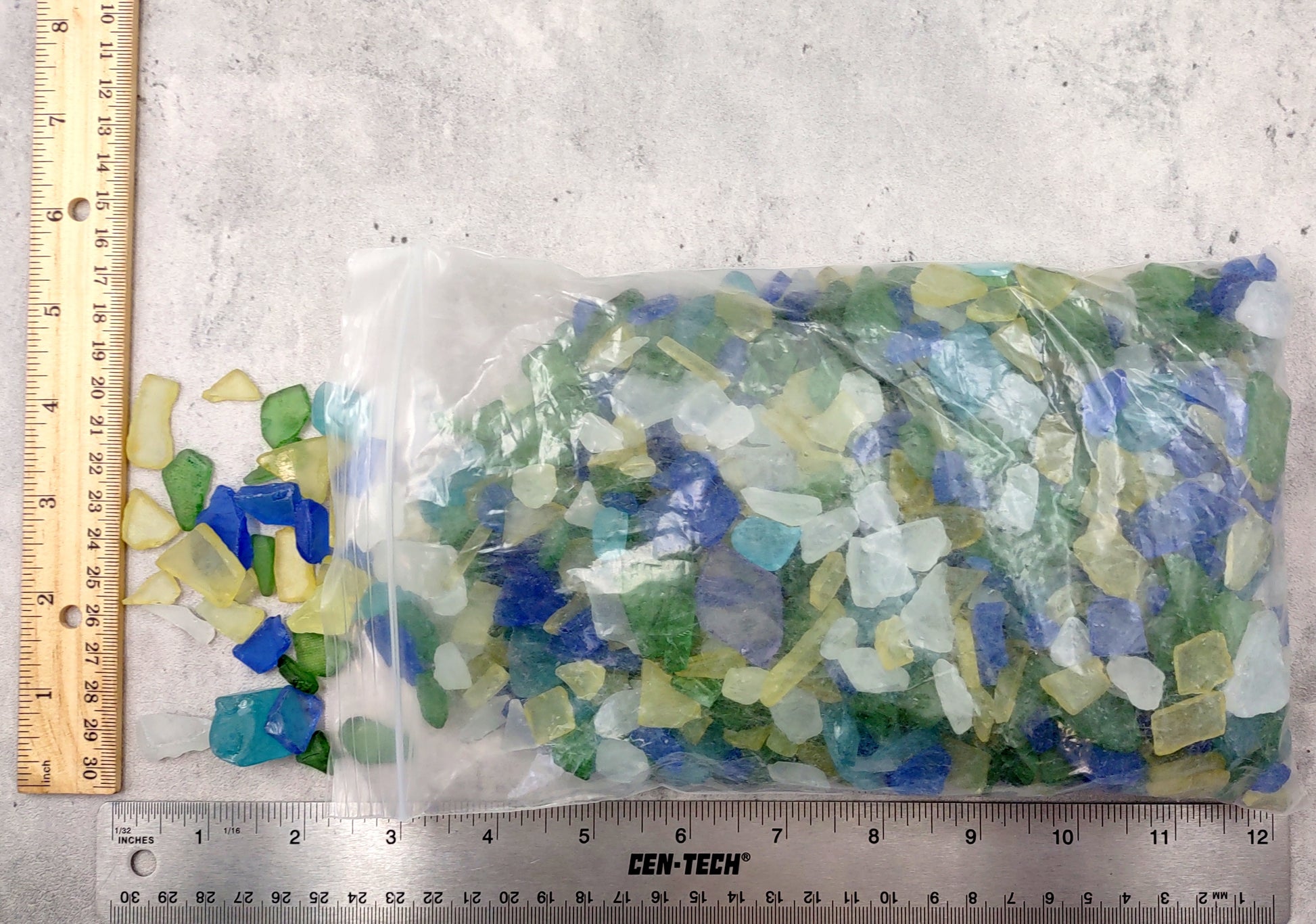Beach Glass - Medium Tumbled Rough Blue, Green & White Atlantic Assorted - (approx. 1 Kilogram/2.2 lbs. .5-1.25 inches). Multiple different shapes and sizes pieces all in a pile. Copyright 2024 SeaShellMart.com.