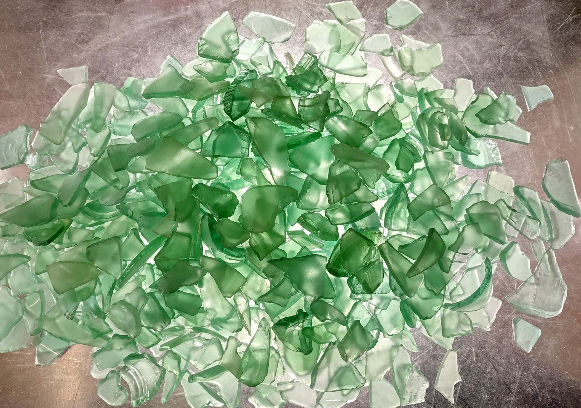Beach Glass - Medium Tumbled Rough Coke Bottle Green - (approx. 1 Kilogram/2.2 lbs. .5-1.25 inches). Multiple green glass pieces in different shapes. Copyright 2024 SeaShellSupply.com.