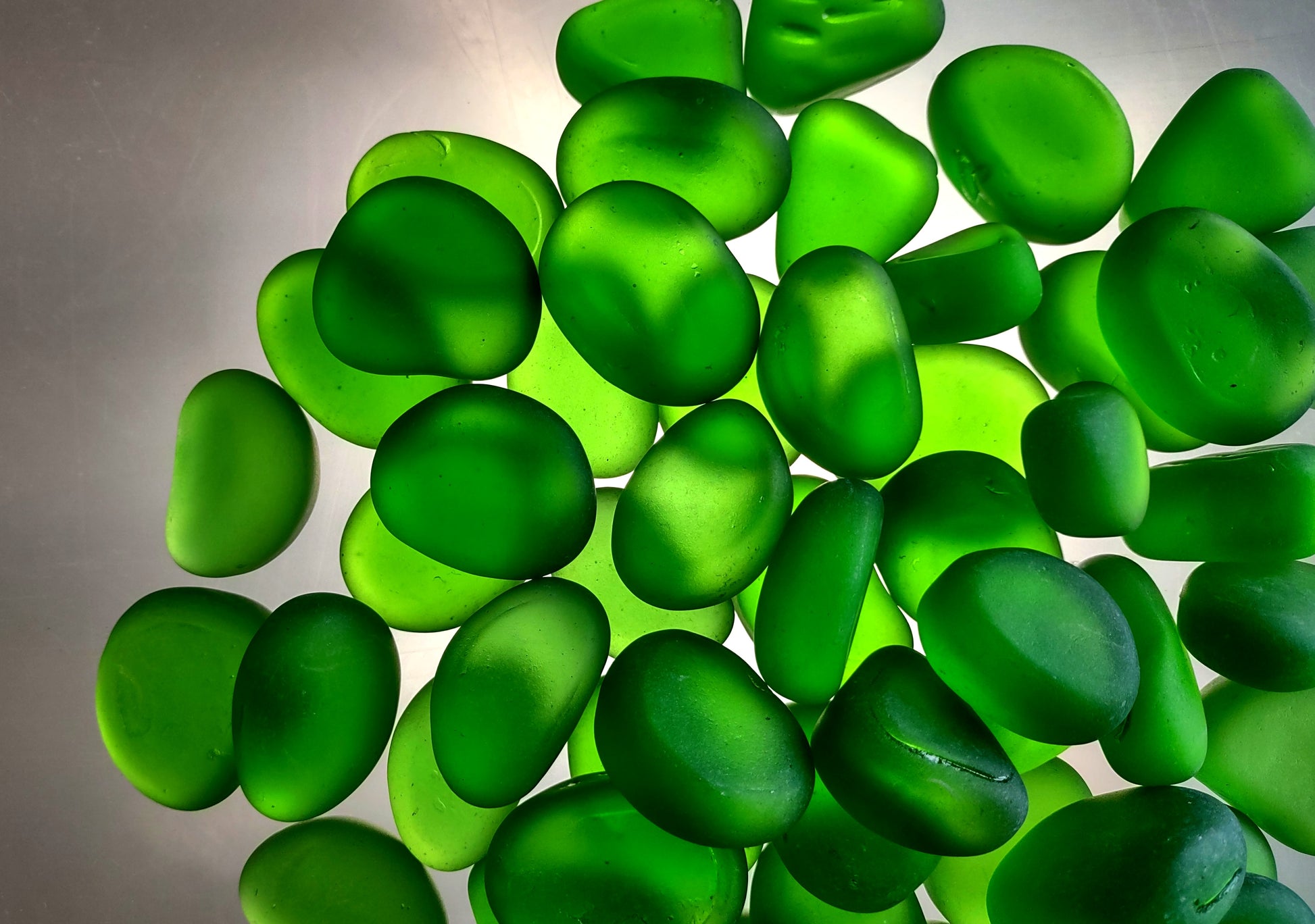 Beach Sea Glass Rounded Green Frosted Tumbled Pebbles (approx. 10 lbs. 1-1.5 inch). Green Beach Glass pebbles. Copyright 2022 SeaShellSupply.com.