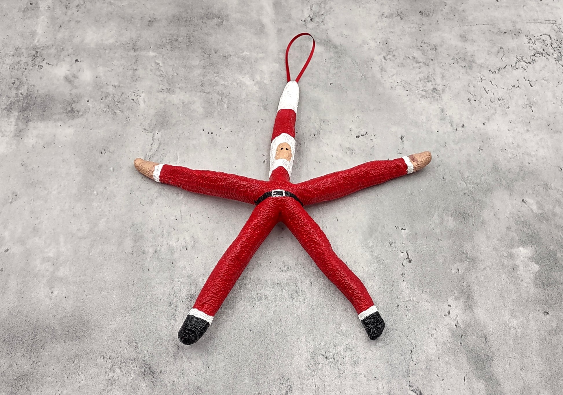 Red Linckia Starfish Santa Claus Ornament (1 seastar approx. 10-12 inches) Painted Santa Claus Starfish Ornament For Coastal Beach Christmas. Copyright 2023 SeaShellSupply.com.