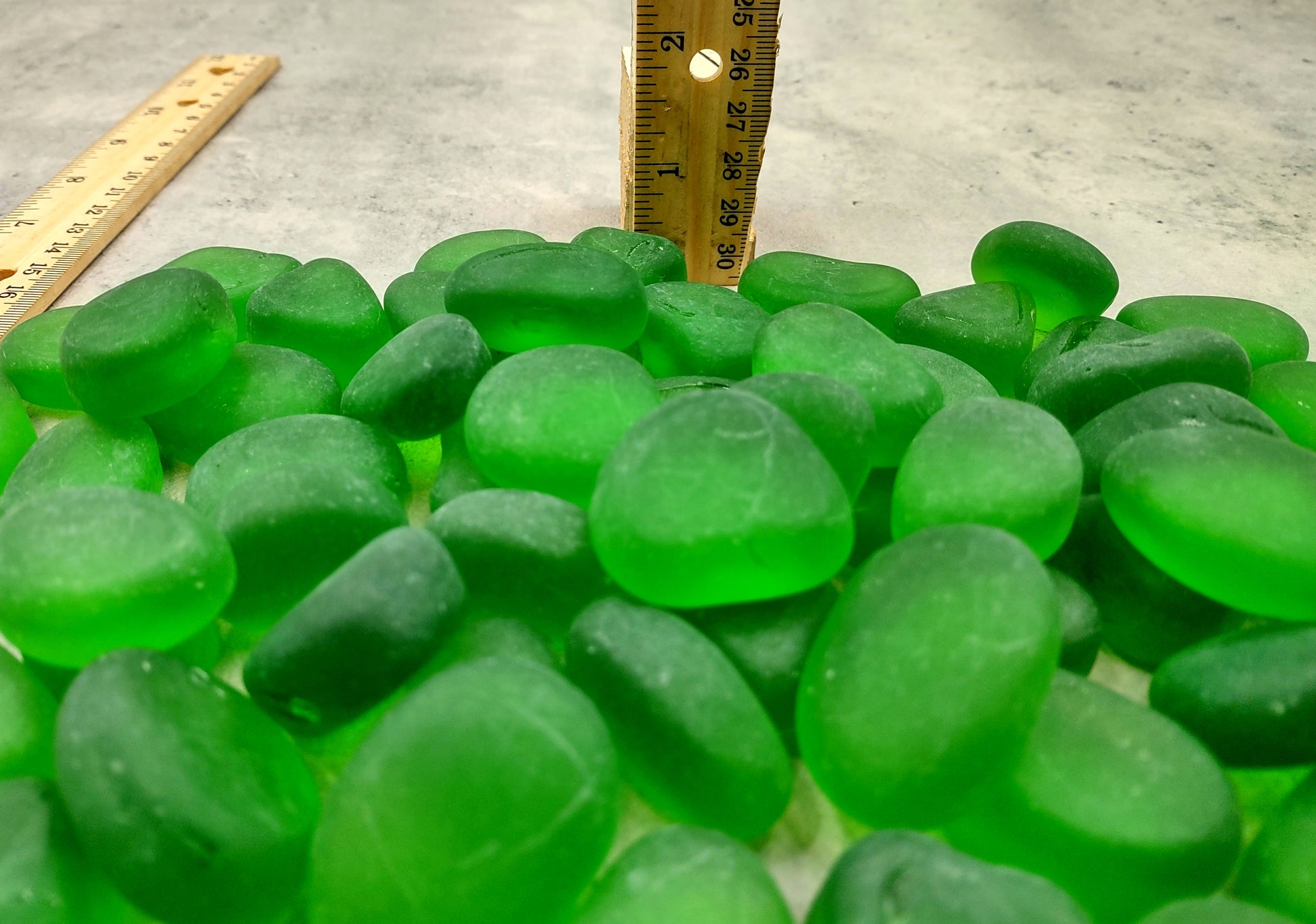 Beach Sea Glass Rounded Green Frosted Tumbled Pebbles (approx. 10 lbs. 1-1.5 inch). Green Beach Glass pebbles. Copyright 2022 SeaShellSupply.com.
