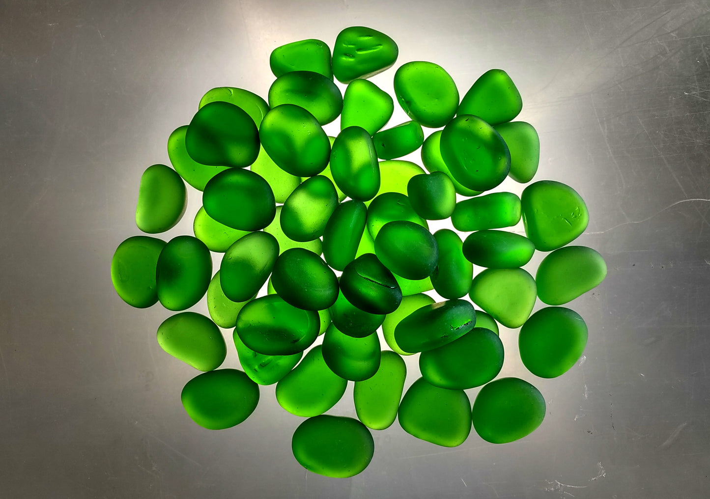 Beach Sea Glass Rounded Green Frosted Tumbled Pebbles (approx. 10 lbs. 1-1.5 inch). Green Beach Glass pebbles. Copyright 2022 SeaShellSupply.com.