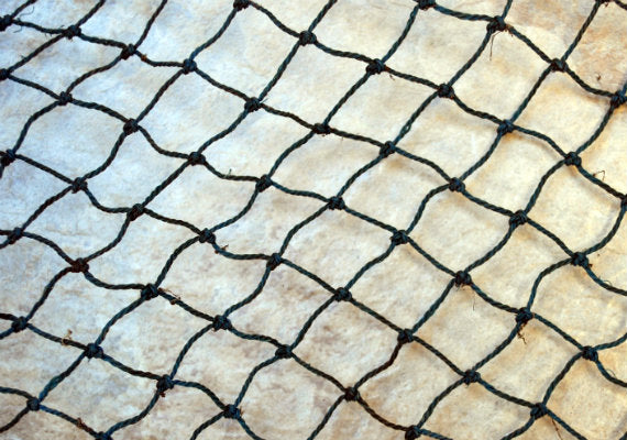 Fishing Net - Used (4 X 8 feet). One black tied fishing net that comes folded and banded. Copyright 2022 SeaShellSupply.com.