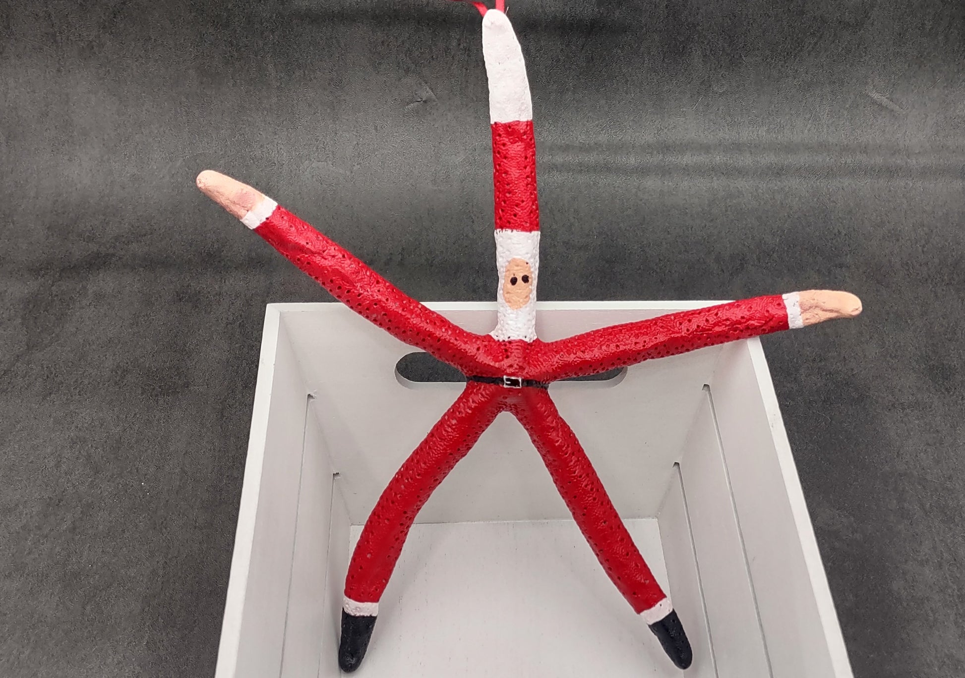 Red Linckia Starfish Santa Claus Ornament (1 seastar approx. 10-12 inches) Painted Santa Claus Starfish Ornament For Coastal Beach Christmas. Copyright 2023 SeaShellSupply.com.