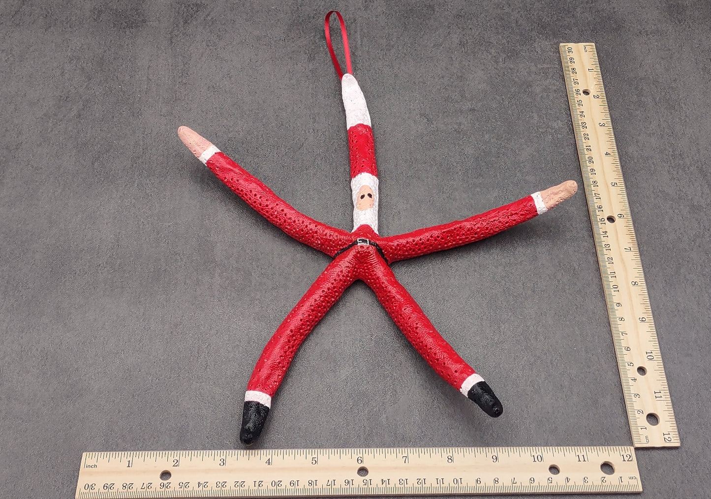 Red Linckia Starfish Santa Claus Ornament (1 seastar approx. 10-12 inches) Painted Santa Claus Starfish Ornament For Coastal Beach Christmas. Copyright 2023 SeaShellSupply.com.