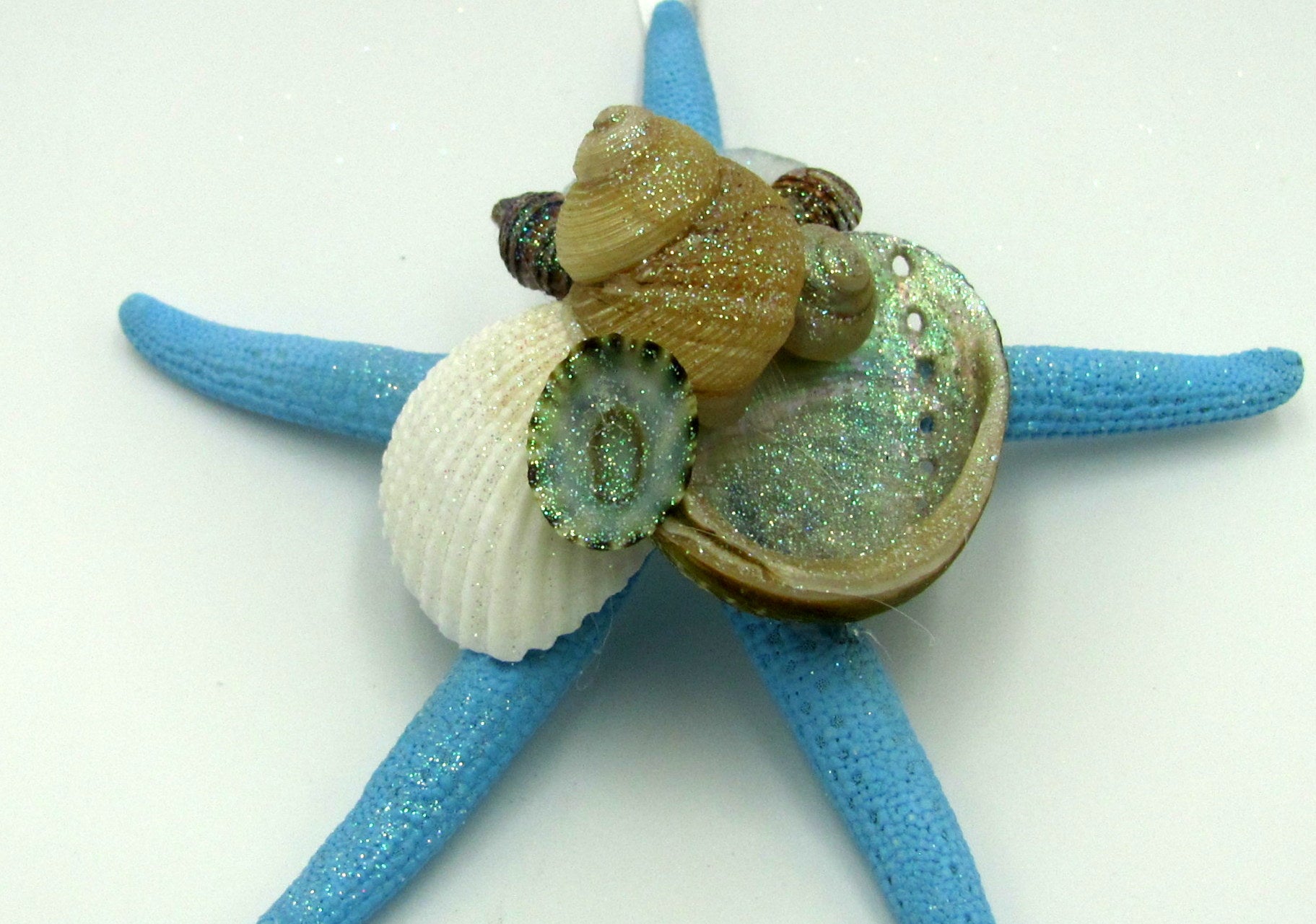 Frosted Seaglass Blue Starfish Ornament (1 star approx. 4-6 inches) on white background. Copyright 2022 SeaShellSupply.com.